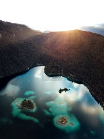 Aerial view of the Eibsee lake with islands and green trees on the lake shore. Germany, Bavaria