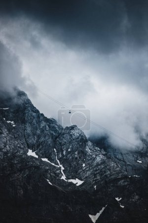 Photo for Cableway over the foggy valley in the mountains - Royalty Free Image