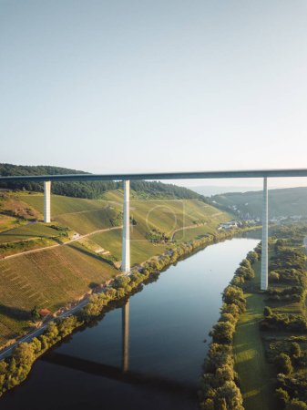 Building of Hochmoselbruecke (High Moselle Bridge) between Uerzig and Zeltingen-Rachtig, Moselle, Germany. Aerial view from drone