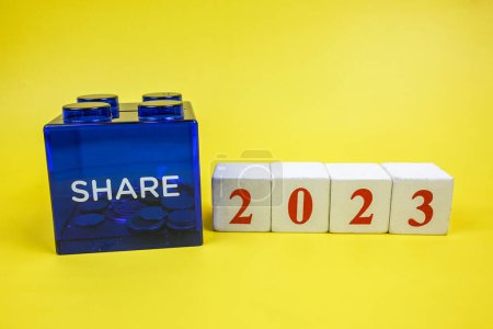 Photo for Share savings box, coins, saving money and financial plan concept for sharing in new year 2023. Donations, charity, organisations, sharing is caring, pay it forward, raising funds concept - Royalty Free Image