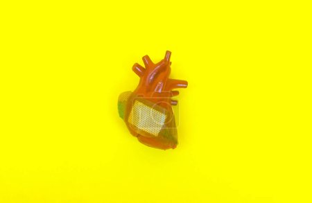 Photo for Human heart with Band-Aid symbolise as heart diseases, heart health, unhealthy heart conditions, heart problems, education and heart health awareness, risks. - Royalty Free Image