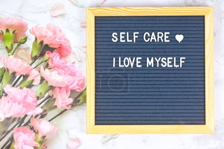 Photo for Grey letter board with phrase Self care, I am loved. Self love, Mindfulness lifestyle, mental health. Aspiration, affirmative and supportive sentence. - Royalty Free Image