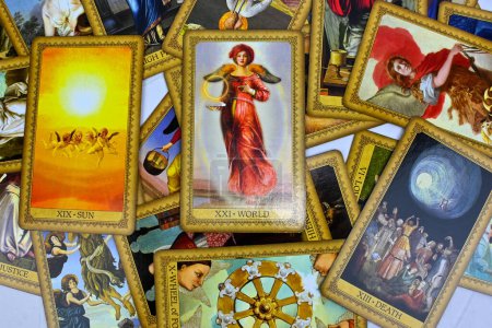 Photo for Bangkok, Thailand 14 feb23, Influence Of The Angels Tarot spreading with the world, the best card on top, wheel of fortune. Intuition spiritual new age tarot reading advices forecasting. - Royalty Free Image