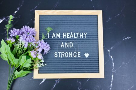 Photo for Grey letter board with phrase Self care, I am healthy and strong. Self love, Mindfulness lifestyle, mental health. Aspiration, affirmative and supportive sentence - Royalty Free Image