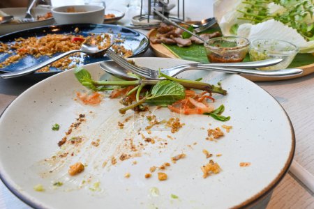 Photo for Leftover food many plates during meal after partying - Royalty Free Image