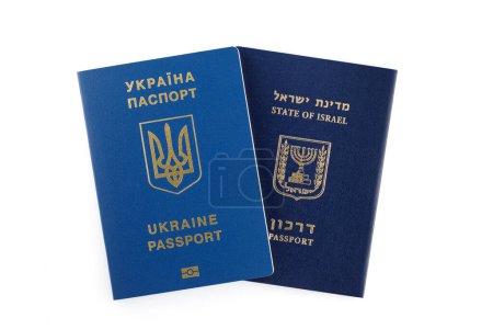 Foto de Israeli and Ukrainian foreign passports isolated on white background. Closeup. - Imagen libre de derechos