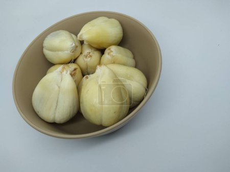 Pondoh salak fruit, the skin of which has been peeled in a bowl, is a type of palm plant native to Indonesia