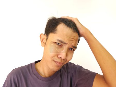 Photo for Shocked face of Asian man getting bald and lost hair in isolated white background - Royalty Free Image