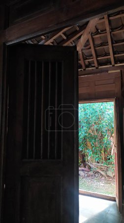 Photo for Javanese traditional door with carved carvings made of wood - Royalty Free Image