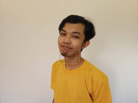 Photo for Asian man feels bored and facing up with isolated background - Royalty Free Image