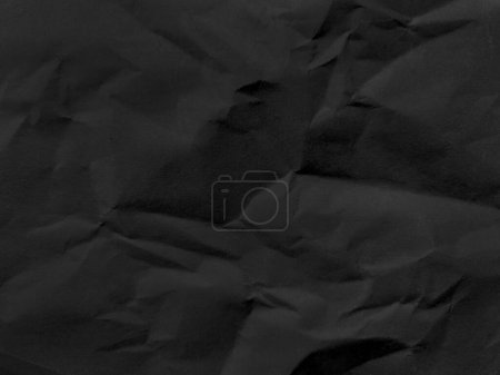 Photo for Black crumpled paper texture in low light background - Royalty Free Image