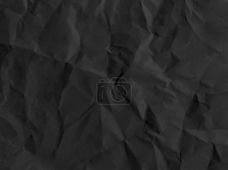 Téléchargez les photos : Black crumpled paper texture in low light background - en image libre de droit