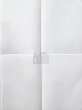 Photo for White sheet of paper folded in four - Royalty Free Image