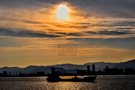 Photo for Boat passing the sea sunset. High quality photo - Royalty Free Image