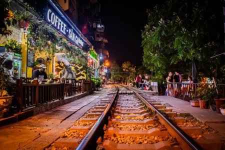 Photo for Hanois Train Street: Where Coffee Awaits Alongside the Tracks. High quality photo - Royalty Free Image
