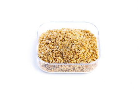 Dry food Daphnia for aquarium fish feed in a transparent box on White background