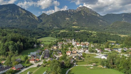 Photo for Aerial view of Trstenik village under Mt. Storzic in the Kamnik-Savinja Alps, Slovenia - Royalty Free Image