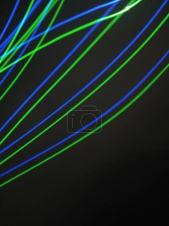 Photo for Night light colorful abstract background, light of night. Blue and red light painting photography, long exposure fairy blue and red lights curves and waves against a black background. Long exposure light painting photography. Abstract pink purple - Royalty Free Image