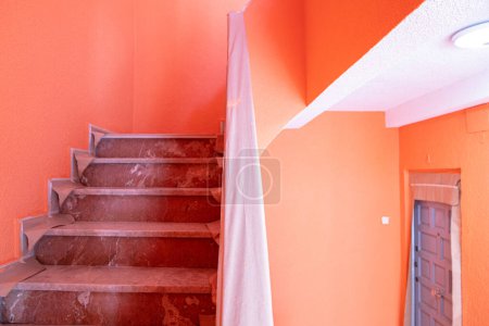 Foto de Stairway drabbled with pain in house with salmon walls and during renovation - Imagen libre de derechos