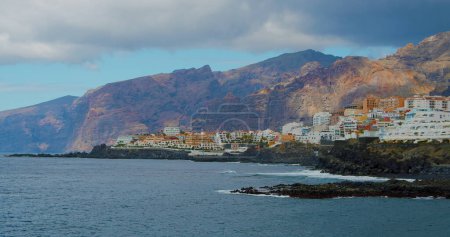 Photo for Sea view from Los Gigantes beach, Cliffs of the Giants at sunset, Tenerife, Canary islands, Spain. Shore of town Puerto de Santiago. High quality 4k footage. - Royalty Free Image
