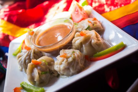 Foto de Momo are bite-size dumplings made with a spoonful of stuffing wrapped in dough with origins from Tibet. - Imagen libre de derechos