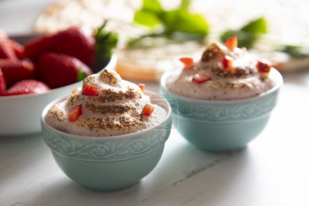 Photo for Strawberry mousse is a dessert of French origin, whose base is egg white mounted until stiff, or whipped milk cream, which give it a spongy consistency. - Royalty Free Image