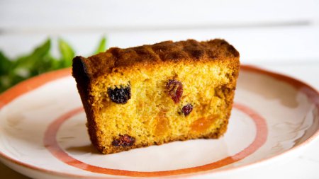 Foto de The fruitcake is a cake made with candied or chopped fresh fruit, nuts and spices, and optionally soaked in liquor. - Imagen libre de derechos