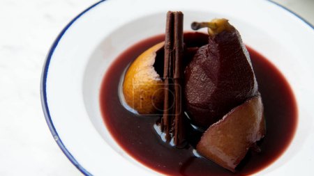 Photo for Pears cooked in red wine with orange. - Royalty Free Image
