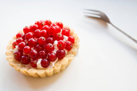 Photo for Currant tarts on a plate with raspberries - Royalty Free Image
