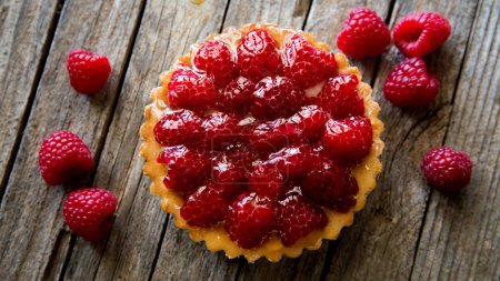Photo for Raspberry tarts on a plate with raspberries - Royalty Free Image
