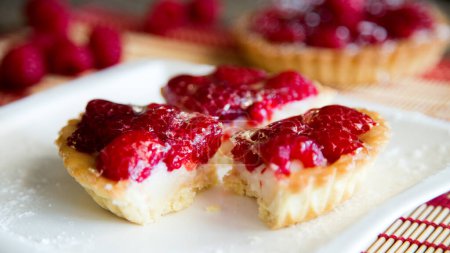 Photo for Raspberry tarts on a plate with raspberries - Royalty Free Image