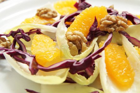 Photo for Endive salad with orange and walnuts. - Royalty Free Image
