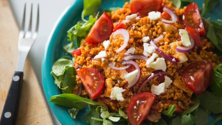 Photo for Bulgur salad with cherry tomatoes and cheese - Royalty Free Image