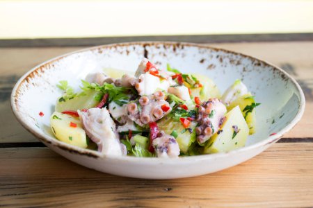 Photo for Delicious salad with boiled potato and octopus. - Royalty Free Image