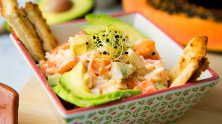 Photo for Delicious salad with mayonnaise, avocado and carrot. - Royalty Free Image