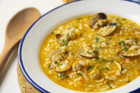 Photo for Rice soup with clams. Traditional Spanish recipe. - Royalty Free Image