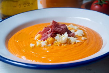 Photo for The Cordovan salmorejo is a cream usually served as a first course; It is a traditional preparation from Crdoba. It is made by mashing a certain amount of bread crumbs, which also includes garlic, olive oil, salt and tomatoes. - Royalty Free Image