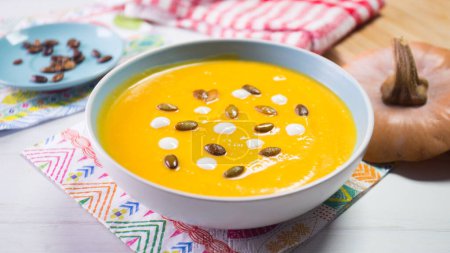 Photo for Bowl with carrot cream and vegetables. - Royalty Free Image
