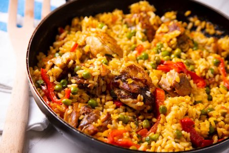 Traditional Spanish paella with chicken and vegetables.