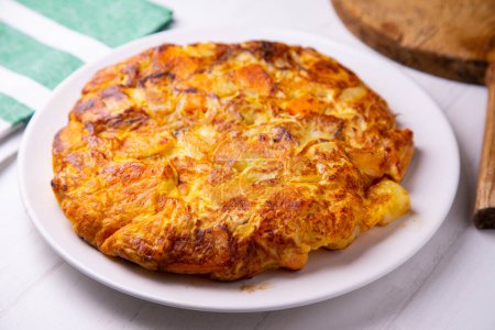 Photo for Spanish omelette with sweet potato is an omelette or omelette to which chopped potatoes are added. It is one of the best-known and most emblematic dishes of Spanish cuisine - Royalty Free Image