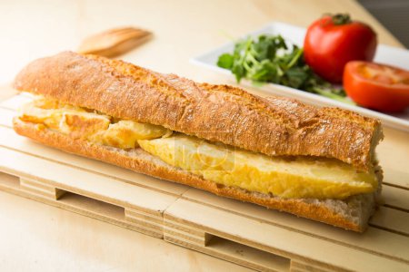 Photo for Delicious sandwich with spanish omelette with egg and potatoes. - Royalty Free Image