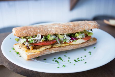 Photo for Delicious sandwich with chicken and salad. - Royalty Free Image