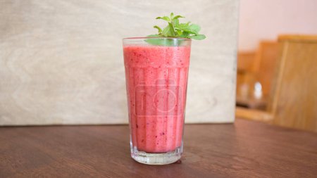 Photo for Delicious and healthy organic natural fruit juice made with strawberry - Royalty Free Image