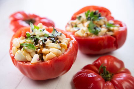 Photo for Tomatoes stuffed with white beans and anchovies. Traditional Spanish tapa. - Royalty Free Image
