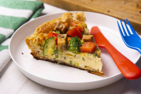 Photo for Vegetarian tart with broccoli, pepper and zucchini in puff pastry. - Royalty Free Image