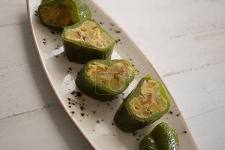 Photo for Italian green peppers stuffed with potato omelette with egg. Traditional Spanish tapa recipe. - Royalty Free Image