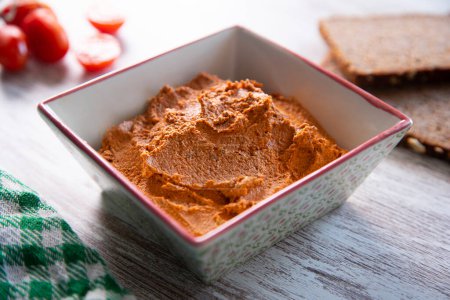 Photo for Toast with vegetarian pate made with dried tomato and other vegetables. - Royalty Free Image