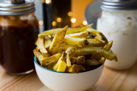 Photo for French Fries are potatoes that are made by cutting them into batons and frying them in hot oil until golden brown and crisp. - Royalty Free Image