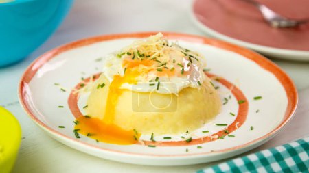 Photo for Boiled and mashed potato with an egg on top. - Royalty Free Image
