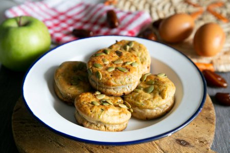 Photo for Salty muffins with vegetables and dates. - Royalty Free Image